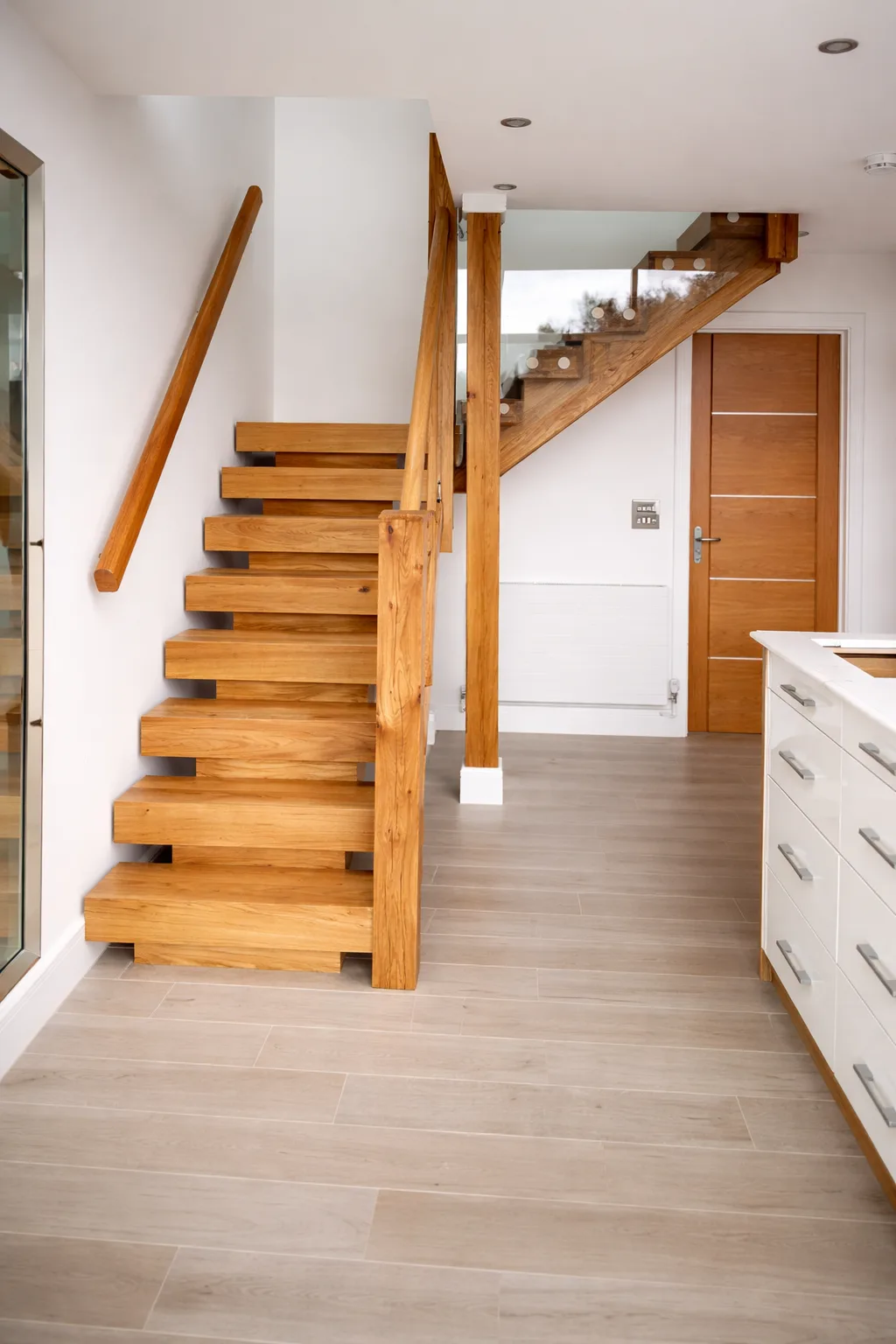 Open-tread oak staircase manufactured by Monarch Joinery